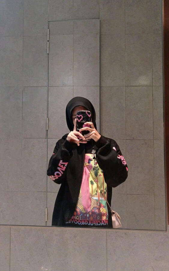Ostrich Groovez, black sweatshirt (worn). 100% cotton.